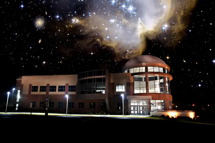 Space Science Center at night with starry sky