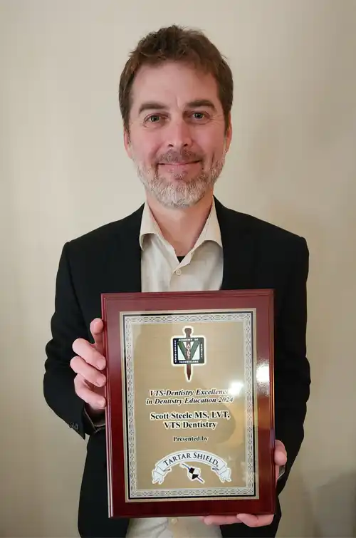 Instructor Scott Steele Holding Award